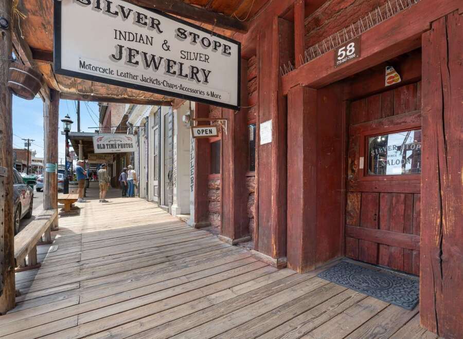 Step back in time with this historic storefront, featuring the 'Silver Stop' Indian & Silver Jewelry shop and a classic saloon.