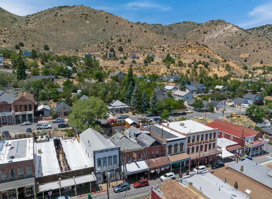 Explore this historic Western town nestled in a picturesque mountain landscape.