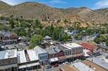 Explore this historic Western town nestled in a picturesque mountain landscape.