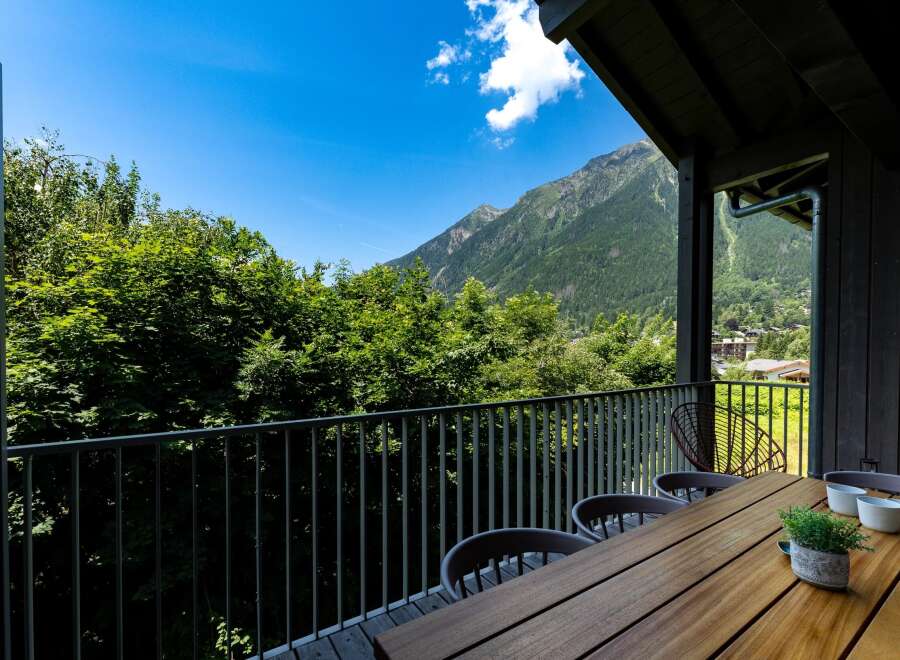 Enjoy breathtaking mountain views from this stunning balcony, perfect for al fresco dining or morning coffee.