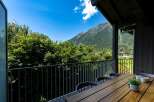 Enjoy breathtaking mountain views from this stunning balcony, perfect for al fresco dining or morning coffee.