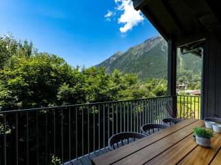 Enjoy breathtaking mountain views from this stunning balcony, perfect for al fresco dining or morning coffee.