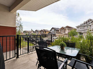 Enjoy outdoor living on this charming balcony, perfect for morning coffee or evening relaxation.