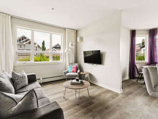 Experience modern living in this beautifully appointed living and dining area.