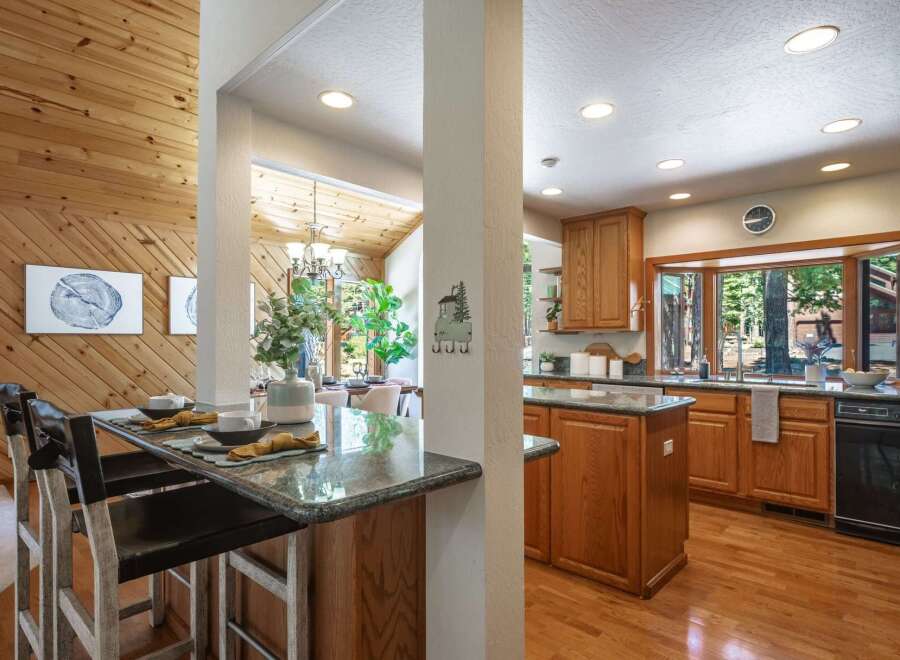 Experience the perfect blend of rustic charm and modern convenience in this stunning kitchen and dining area.