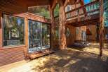 Experience the ultimate indoor-outdoor living with this stunning wooden deck, perfect for entertaining or relaxing amidst nature.