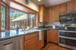 This charming kitchen boasts beautiful oak cabinetry and granite countertops, perfect for any home chef.