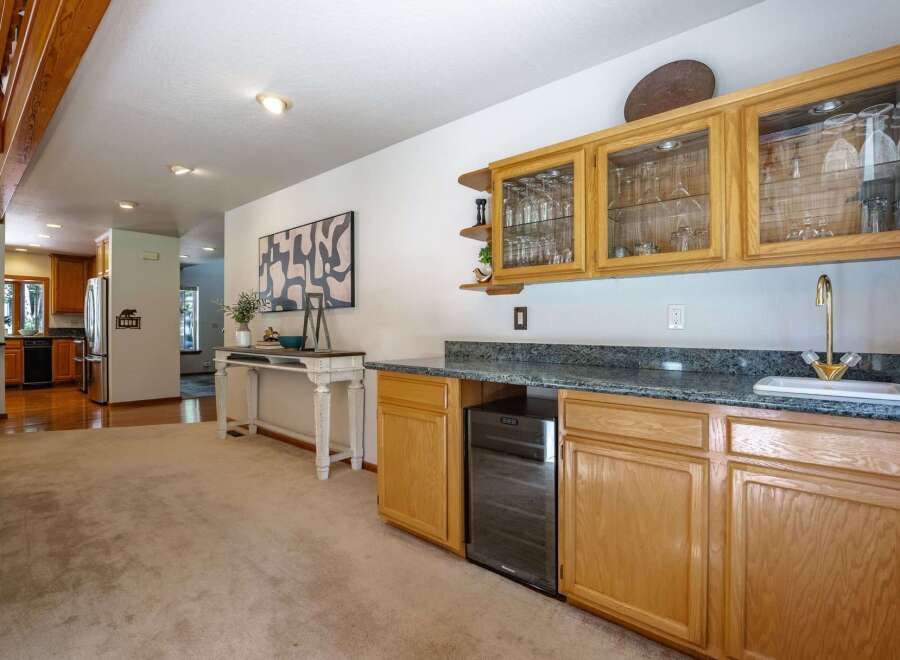 This spacious home features a well-appointed wet bar area, perfect for entertaining guests.