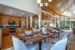 Experience open-concept living in this stunning home, featuring a gourmet kitchen with ample cabinet space and stainless steel appliances, seamlessly flowing into a spacious dining area perfect for entertaining.