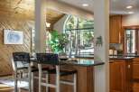 Experience the perfect blend of rustic charm and modern comfort in this inviting kitchen and dining area.