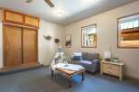 Step into a cozy living space featuring a charming teepee and plush seating, perfect for relaxation.