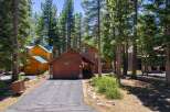 Nestled amongst towering pine trees, this charming wooden cabin offers a serene mountain retreat.