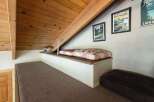 Discover this charming loft space, perfect for relaxation or an extra sleeping area.