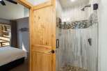Step into this beautifully appointed bathroom featuring a spacious walk-in shower with elegant tile work and modern fixtures.