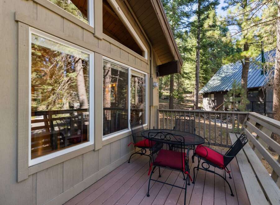 Enjoy your morning coffee or evening drinks on this charming deck, complete with a wrought iron table and chairs.