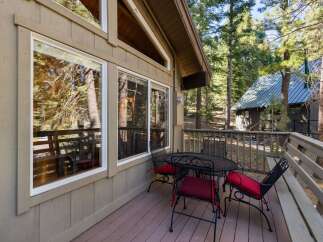 Enjoy your morning coffee or evening drinks on this charming deck, complete with a wrought iron table and chairs.