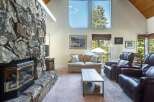Experience cozy living with this stunning stone fireplace, perfect for gathering on cool evenings.