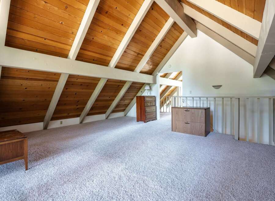 Discover this charming attic space, perfect for a home office or bonus room.
