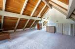 Discover this charming attic space, perfect for a home office or bonus room.