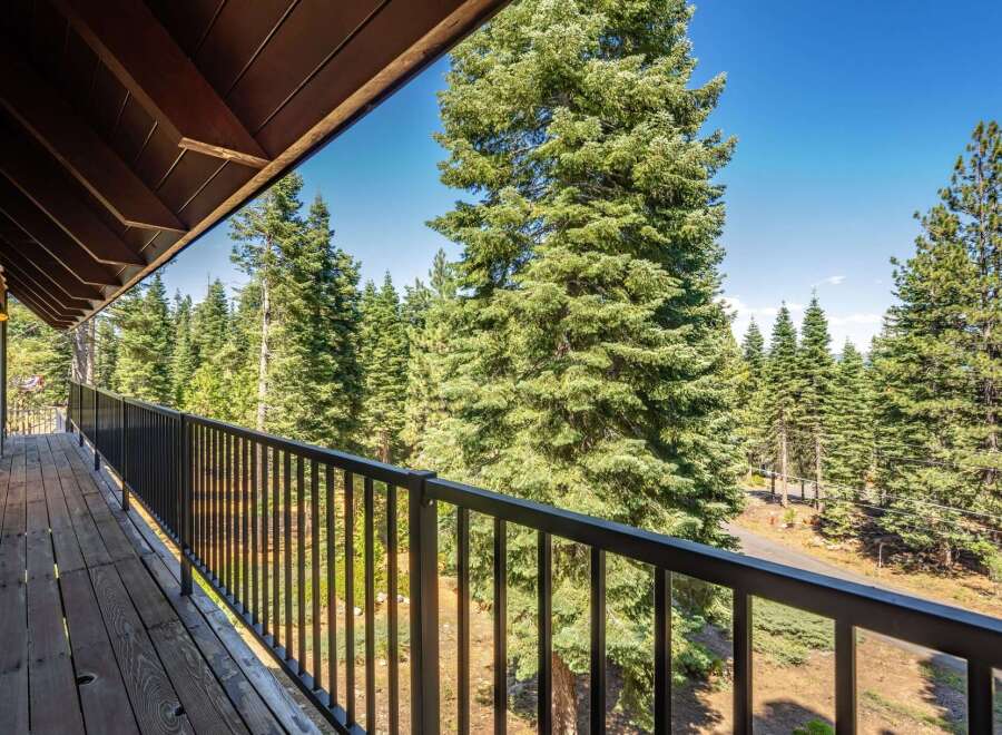 Enjoy breathtaking forest views from this charming balcony, perfect for morning coffee or evening relaxation.