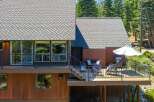 Enjoy outdoor living on this spacious deck, complete with a grill and umbrella for sunny days.