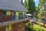 Experience mountain living with this stunning property featuring a spacious deck perfect for outdoor entertaining and enjoying the surrounding nature.