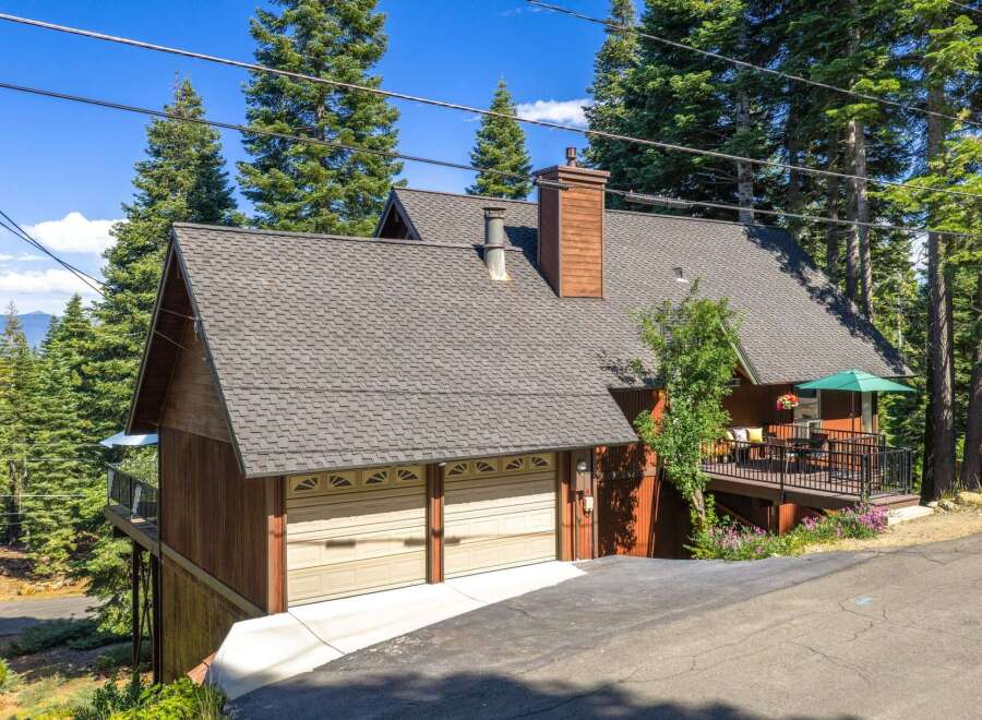 Nestled amidst towering pine trees, this charming mountain home offers a serene escape.
