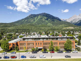 Discover this stunning property nestled against a majestic mountain backdrop, offering breathtaking views and a serene environment.