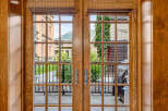 Step outside through these elegant French doors to a charming patio area, perfect for enjoying the fresh air and mountain views.