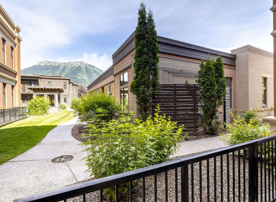 Discover modern living in this stunning property featuring a contemporary architectural design with warm wood accents and elegant brickwork.