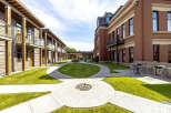 Discover modern living in this beautifully designed courtyard featuring contemporary architecture with wood and brick facades.