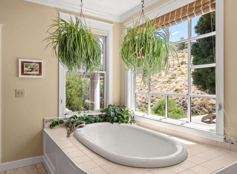 Indulge in relaxation in this stunning bathroom featuring a luxurious freestanding bathtub.