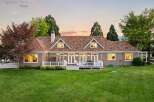 This charming home features a spacious backyard with a large deck perfect for entertaining.