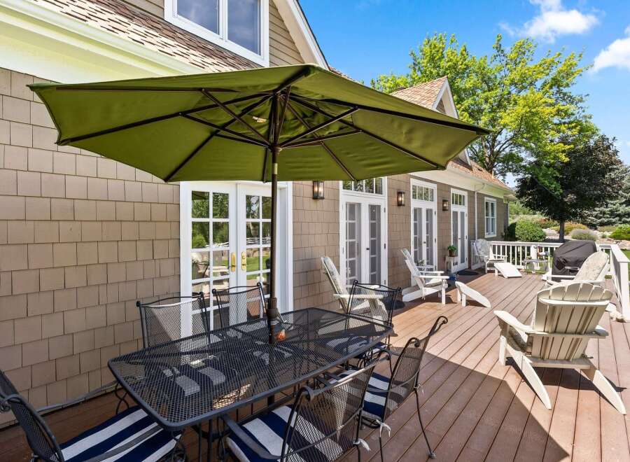 Enjoy outdoor living on this expansive deck, perfect for entertaining or relaxing.