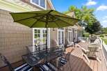 Enjoy outdoor living on this expansive deck, perfect for entertaining or relaxing.