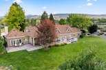 Discover this stunning property featuring a spacious multi-level deck perfect for entertaining, overlooking a beautifully manicured lawn and mature trees.