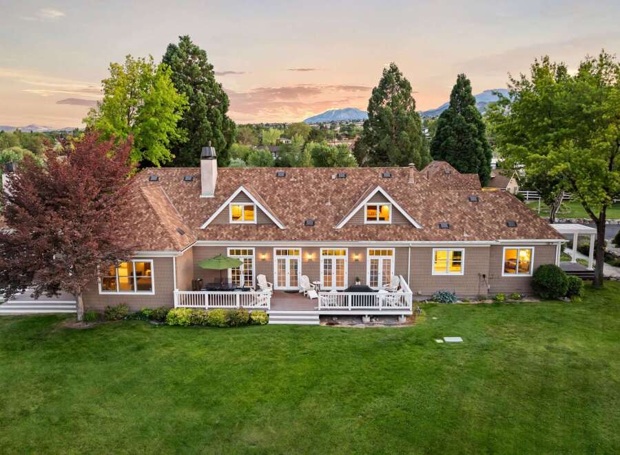 Experience luxurious living in this stunning home featuring a spacious deck perfect for entertaining and enjoying the serene sunset views.