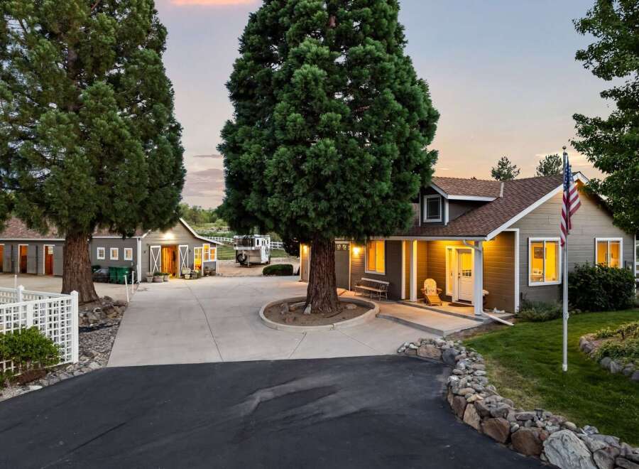 Discover this charming property featuring a welcoming home with a covered porch and an attached garage, perfect for comfortable living.