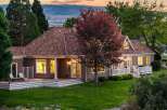 This charming home features a spacious wrap-around deck perfect for outdoor entertaining and enjoying the serene sunset views.