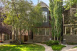 Discover this charming townhouse featuring a striking stone facade and a multi-level design.