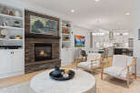 Experience modern living in this beautifully appointed home, featuring a stunning stone fireplace as the centerpiece of the living room.