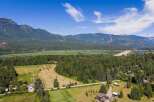 Discover this expansive property nestled amidst breathtaking mountain scenery and lush greenery.