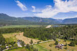 Experience breathtaking mountain views and serene natural beauty from this expansive property.