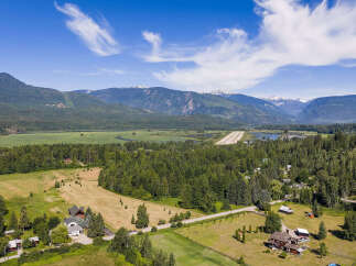 Experience breathtaking mountain views and serene natural beauty from this expansive property.