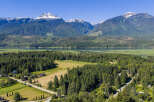 Discover your dream home nestled amidst breathtaking mountain scenery and a serene lake.