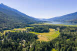 Discover this stunning property nestled amidst lush greenery and majestic mountains.