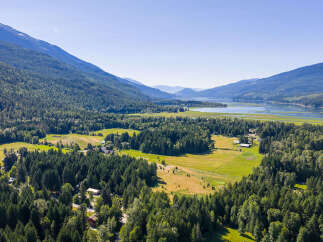 Discover this stunning property nestled amidst lush greenery and majestic mountains.