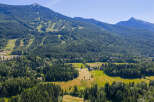 Discover this stunning property nestled amidst lush greenery and majestic mountains.