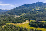Discover this stunning mountain property offering breathtaking panoramic views and a serene natural setting.