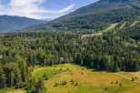 Nestled amidst a lush, evergreen forest, this property offers a serene escape with stunning mountain views.
